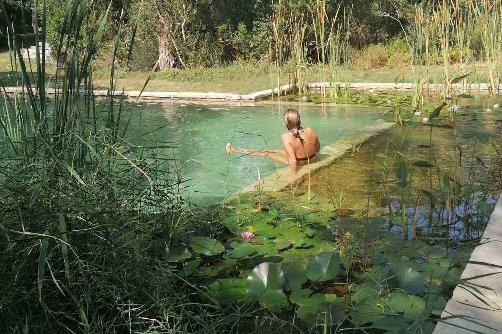swimming in a natural  pool